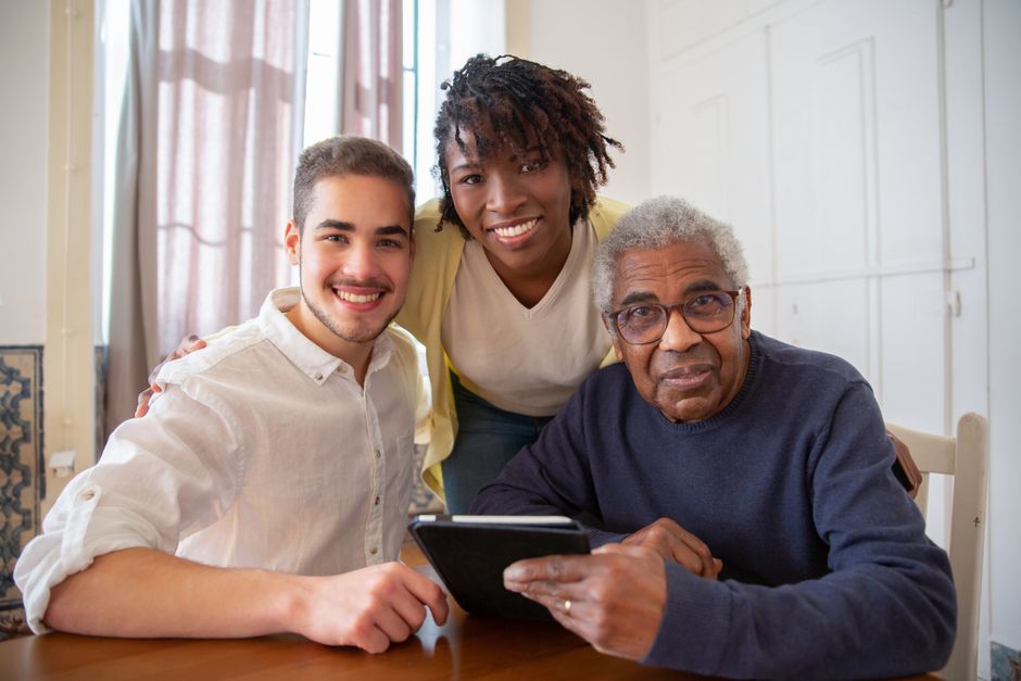 Family reviewing the average cost of assisted living by state 2026 with an older relative at home