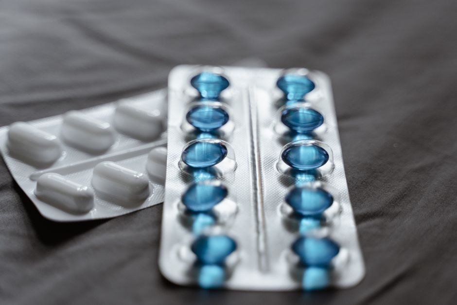 Prescription medication in blister packs illustrating what does Medicare Part D cost in 2026